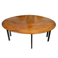 English 1820s Mahogany Drop Leaf Dining Table with Oval Top and Ebonized Legs