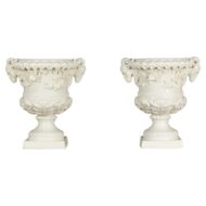 Pair of Blanc de Chine Midcentury Urns with Rams Heads and Ivy Leaves
