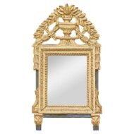 A French petite size carved mirror in giltwood with urn and laurel motifs on the crest.
